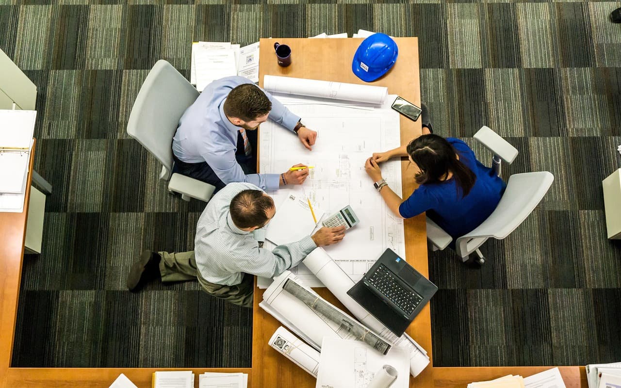 Colleagues gathered around a table during a working meeting